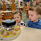 Kids looking closely at fertilized hatching eggs in the incubator